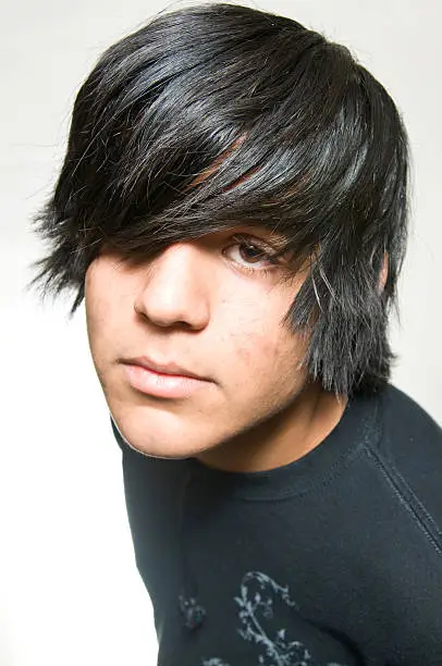 Photo of Teen portrait dressed in black on white background