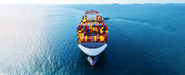 istock Front of cargo ship carrying container and running for export goods from cargo yard port to custom ocean concept technology transportation , customs clearance. Freight Forwarding Service 1460014583