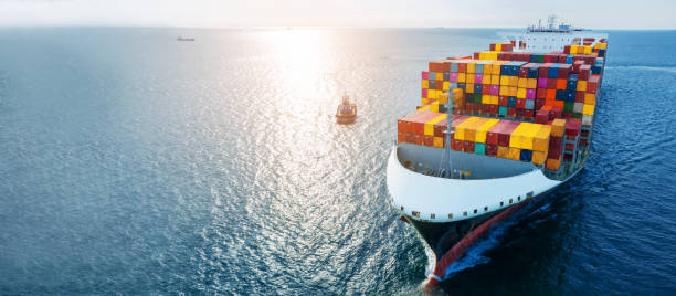 istock Side of cargo ship carrying container and running for export goods from cargo yard port to custom ocean concept technology transportation , customs clearance. Freight Forwarding Service 1460014584