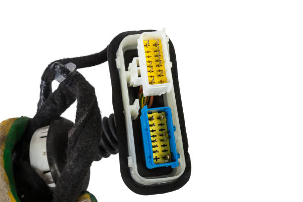 istock A modern car connector or trailer for closing an electrical circuit that a mechanic holds in gloves during repairs. 1460014647