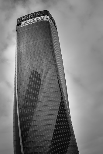 Milan, Italy - 2023, January 22 : One of the three towers of the new City Life business district of Milan called the Twisted One or the Generali tower - monochrome