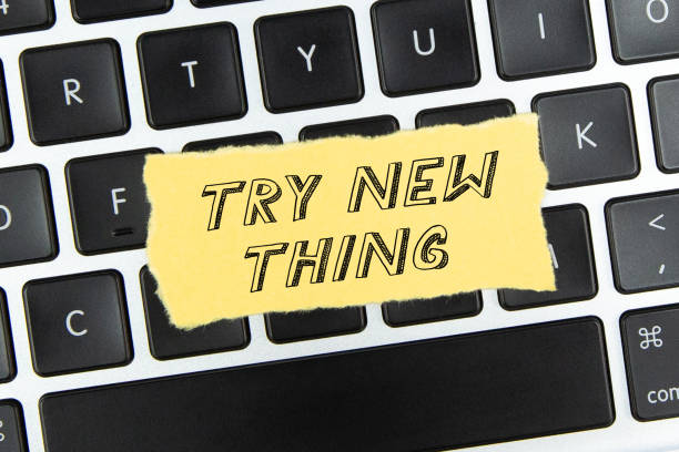 istock Try new thing on torn paper on top of laptop keyboard 1460014965