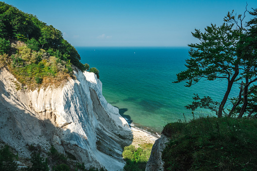 Just under two hours south of Copenhagen is one of Denmark’s biggest and most surprising wonders, Mons Klint (Møns Klint). The 70 million-year-old chalk cliffs (up to 120 meters) are gentling crumbling into the Baltic Sea on the island of Møn, making the water beautifully clear and inviting.