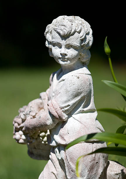 istock Statue of Boy in a Garden 146001665