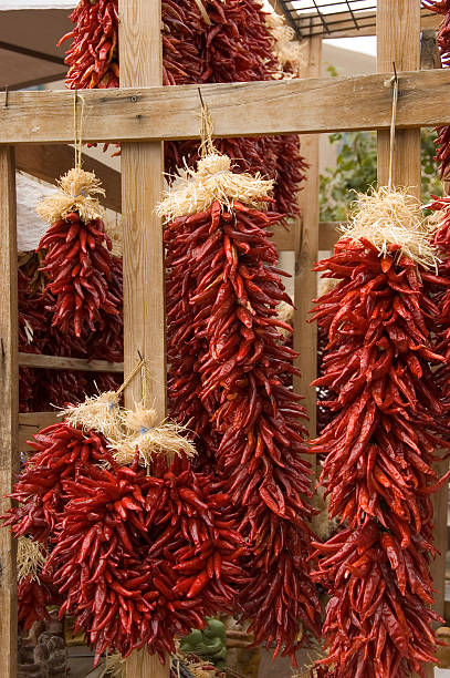 istock Red Chili Peppers hanging on wood. 146001753