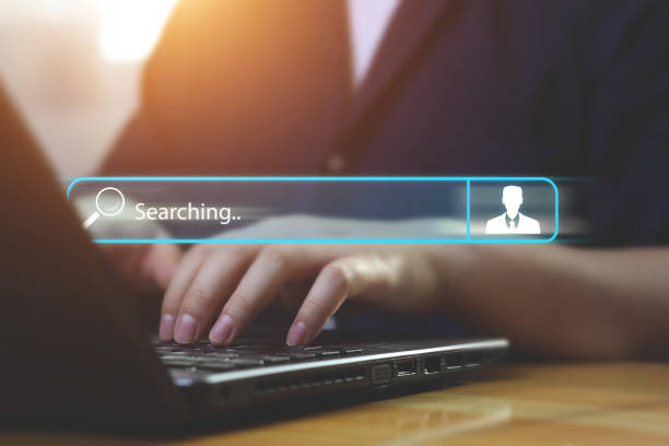 istock Side view man hand typing on laptop computer keyboard on table. toolbar to search for information with a human icon. 1460019041