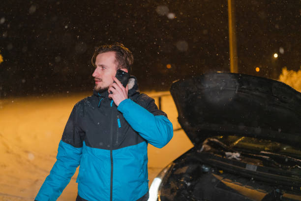Young man's car stuck in the snow
