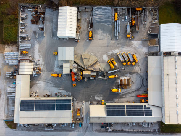 istock Construction and concrete factory with solar panels, top down view 1460020536