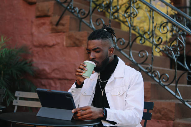 istock freelancer doing work in a cafe in Brooklyn, NYC 1460021901