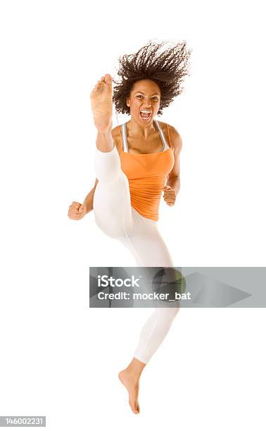 Deportivo Mujer Saltar Y Coleando Motion Blur Foto de stock y más banco de imágenes de Mujeres - Mujeres, Una sola mujer, Dar una patada
