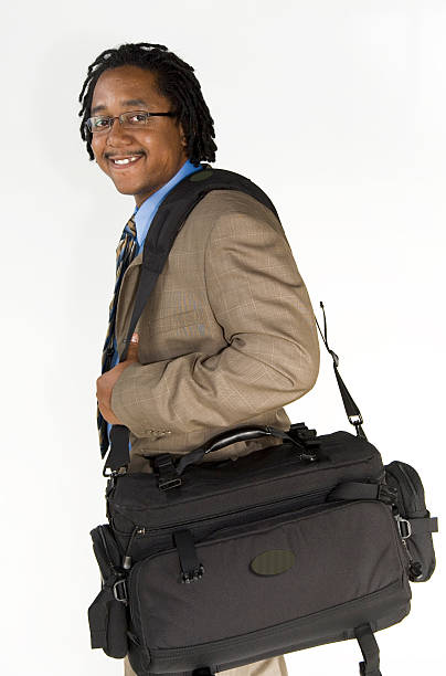 young businessman traveling with briefcase stock photo