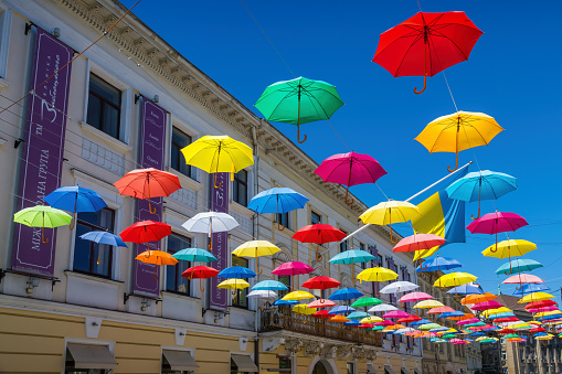 Colorful Umbrellas above a street in downtown Lviv, Ukraine on a sunny day.