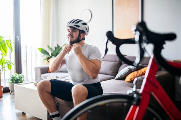 istock Man putting on helmet to get ready for a ride. 1460024819