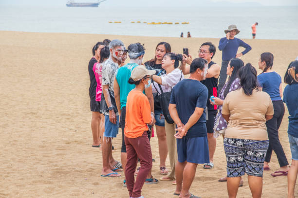 Thailand recently reopened its border to foreign tourists.\nCurrently, Chinese nationals durefebn to spend their holidays in Thailand again\nIn this picture are  Asian vacationers or day trippers doing their activities on the beach of Jomtien near Pattaya District Chonburi in Thailand Asia\n27. January 2023