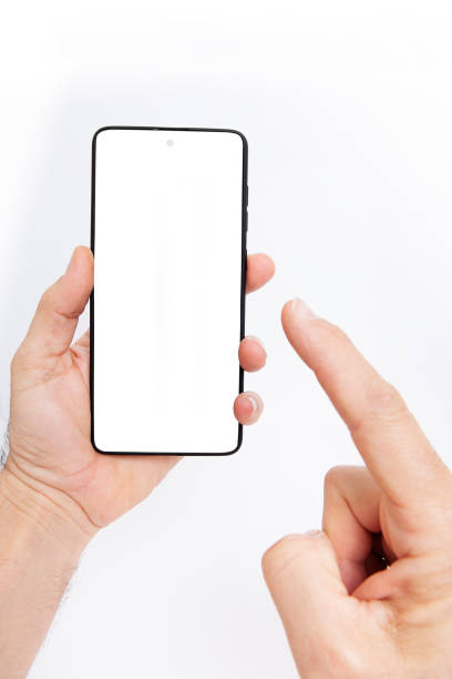 istock Mobile phone on white background. Hand holding mobile phone on white background. 1460031029