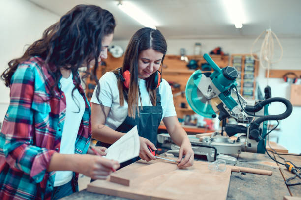 istock Female Designer And Carpenter Joining Forces On New Project 1460033137