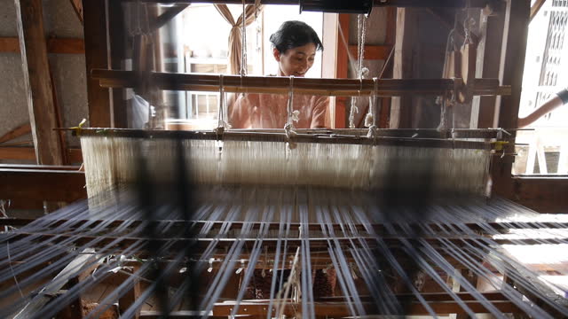 Woman weaving on a traditional loom