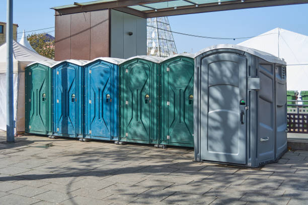 istock Six plastic toilet cabins of different colors. 1460033823