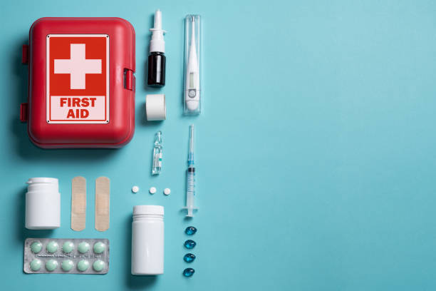 istock Home first aid kit on a blue background. The elements of the first aid kit 1460035784