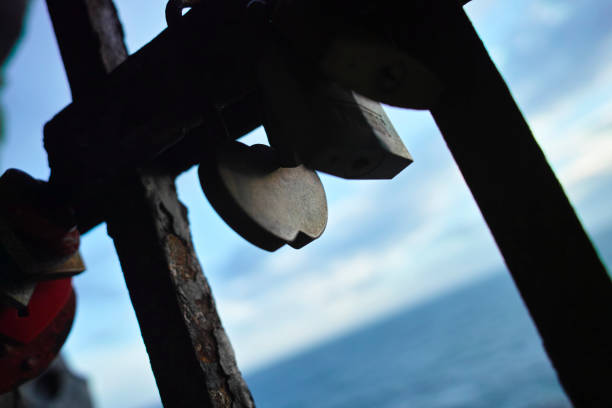 padlocks attached to a railing as a sign of love