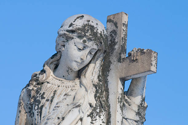 istock Female Statue holding cross 146003775