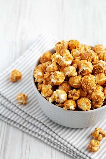 Homemade Caramel Popcorn in a gray Bowl, side view.