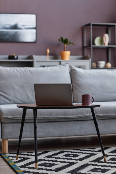 istock Comfortable couch in elegant home interior with mauve wall 1460038905