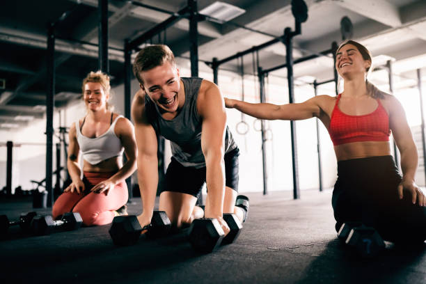 istock Athletes resting after weightlifting training at the gym 1460040199