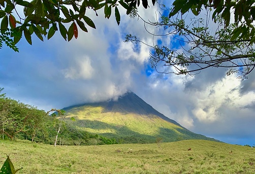 Scenic view of Arenal Volcano with blue skies  inside the Arenal National Park, Costa Rica. OLYMPUS DIGITAL CAMERA