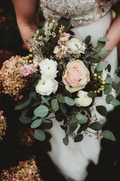 istock Bride holding wedding bouquet 1460042890