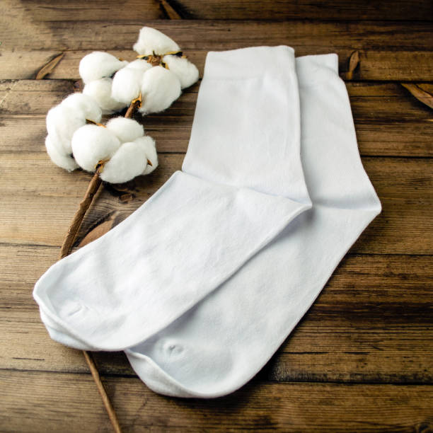 White socks and cotton are on the table.