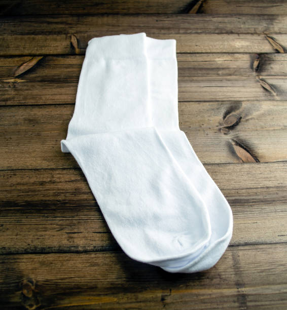 istock White cotton socks on a wooden table. 1460044720