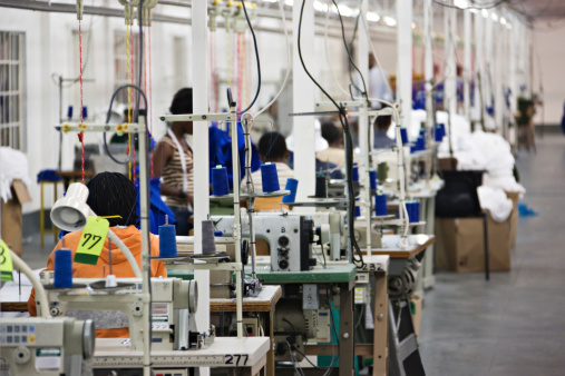 Industrial size textile factory in Africa, African workers on the production line