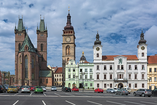 Hradec Kralove, Czech Republic - August 12, 2019: Western side of the Great Square with Cathedral of the Holy Spirit (founded in 1307), White Tower (founded in 1574) and Old Town Hall (first mentioned in 1418, subsequently rebuilt many times).