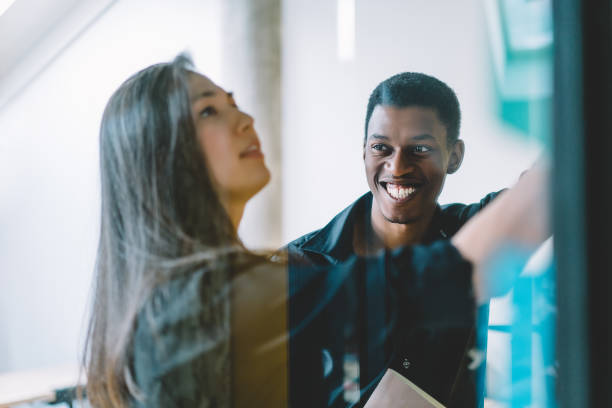 istock Joyful black man looking at colleague during work 1460047734