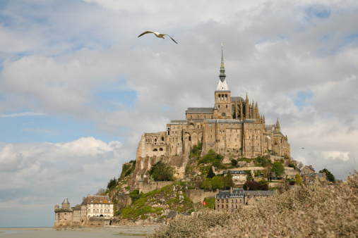 Mont Saint-Michel, the island fortress, castle, cathedral, abbey, and village of Brittany, France.