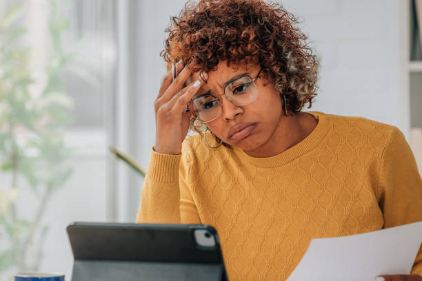 istock woman or client at home stressed or overwhelmed with expenses and bills 1460049117