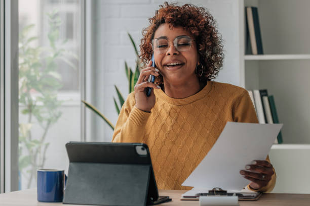 istock woman or client at home with bill and laptop 1460049129