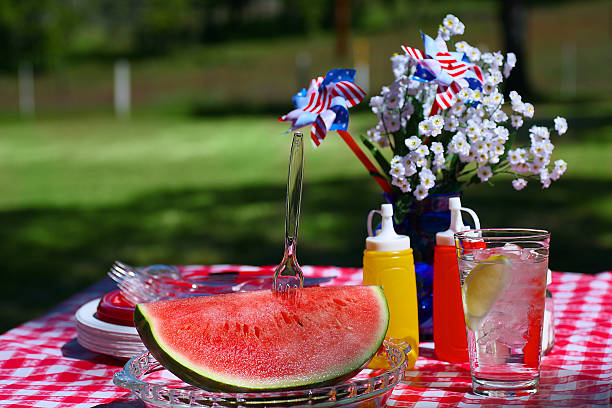istock Watermelon sitting on an outdoor table with a checked cloth 146005006