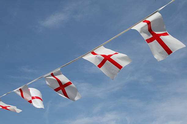 Flag of St George - England Euro 2012 English Pride Saint George Flag bunting against beautiful blue sky international team soccer photos stock pictures, royalty-free photos & images