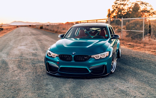 Seattle, WA, USA
January 1, 2023
Blue BMW M3 parked at an angle with a fence in the background