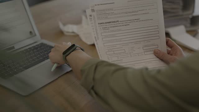 Family allowance form in German language in the hands of a female