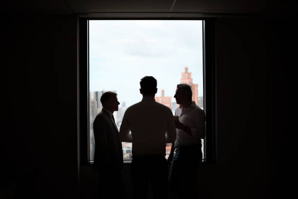istock business team working at office ,silhouette style 1460054550