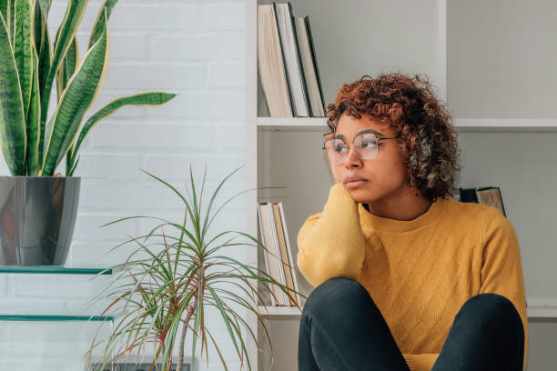 istock girl at home alone thoughtful 1460057034