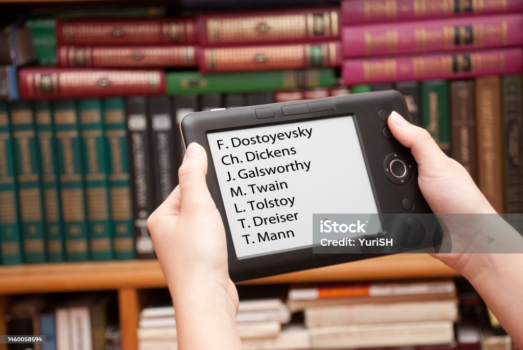 E-library Electronic library against old books Book Stock Photo