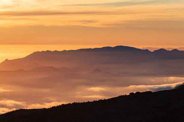 Landscape of the peaks of the Sierra de Tejeda,Almijara and Alhama between shadows and clouds at sunset seen from Sierra Nevada,Granada Landscape of the peaks of the Sierra de Tejeda,Almijara and Alhama between shadows and clouds at sunset seen from Sierra Nevada. almijara stock pictures, royalty-free photos & images