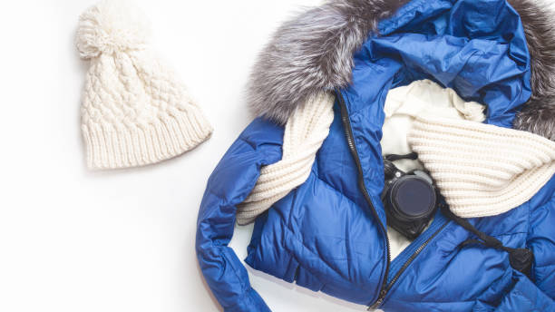 istock Warm clothes with photo camera on white white background. Winter vacation concept 1460058885