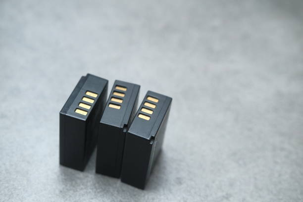 istock Black batteries for photographers against grey table 1460059333