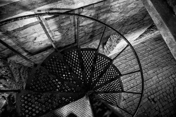 istock Iron stairs inside an abandoned brick stone house 1460061118