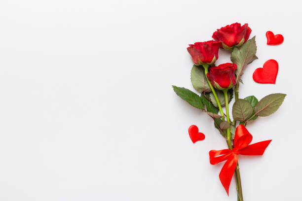 istock Valentine day composition with rose flower and red heart on table. Top view, flat lay, copy space Holiday concept 1460063867